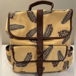 “Lucky” Twill back pack. Mustard color w/feather design & brown leather trim.